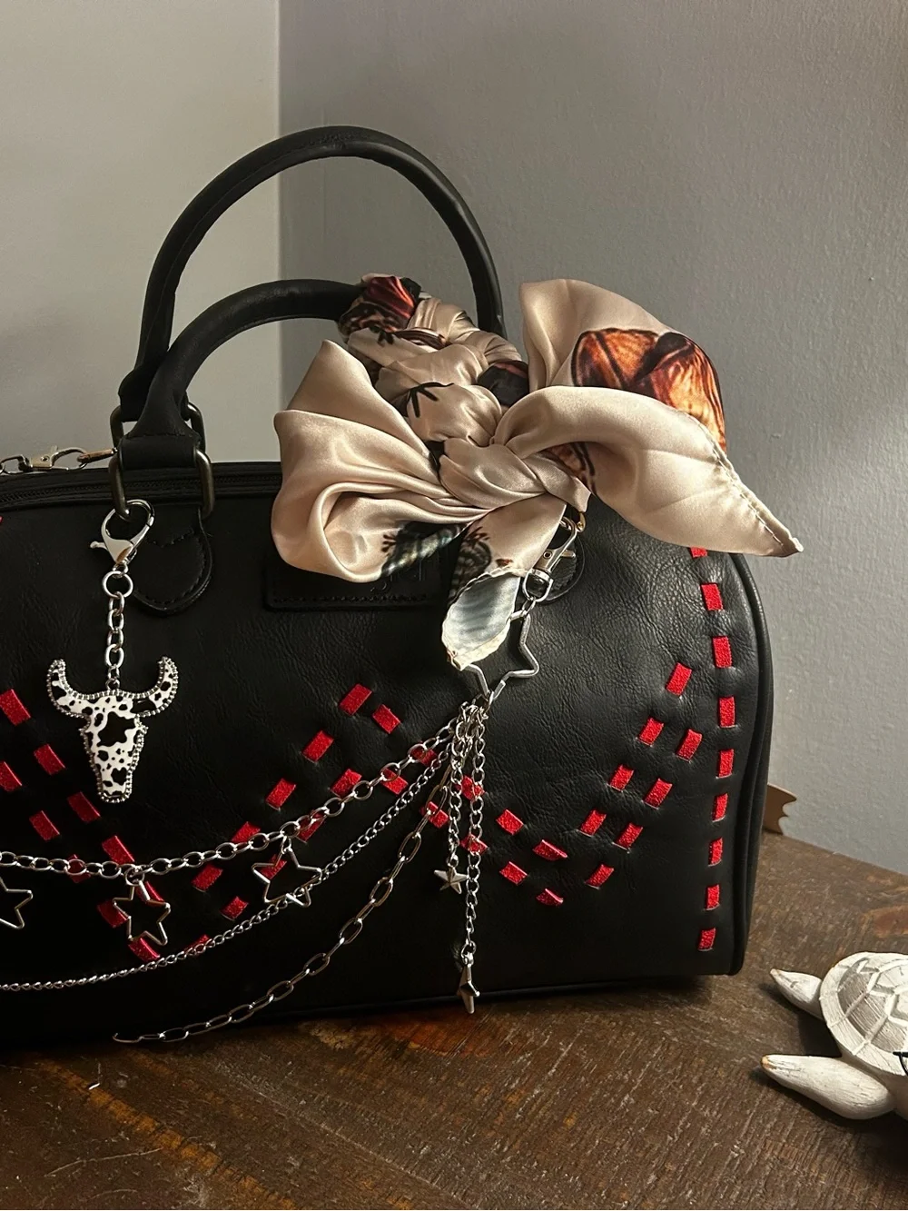 Black Satchel Handbag with Red Accents and Cream Bow